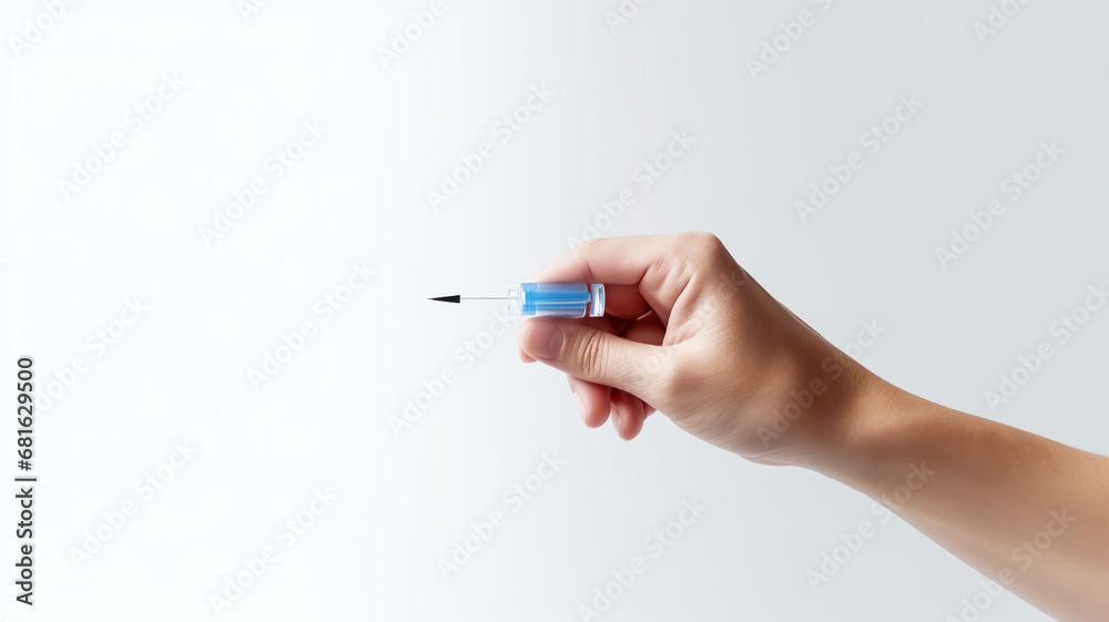The doctor's hand is the main subject, as it holds The doctor's hand is the main subject, as it holds
