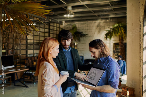 Architects discussing laptop design in the office © Geber86