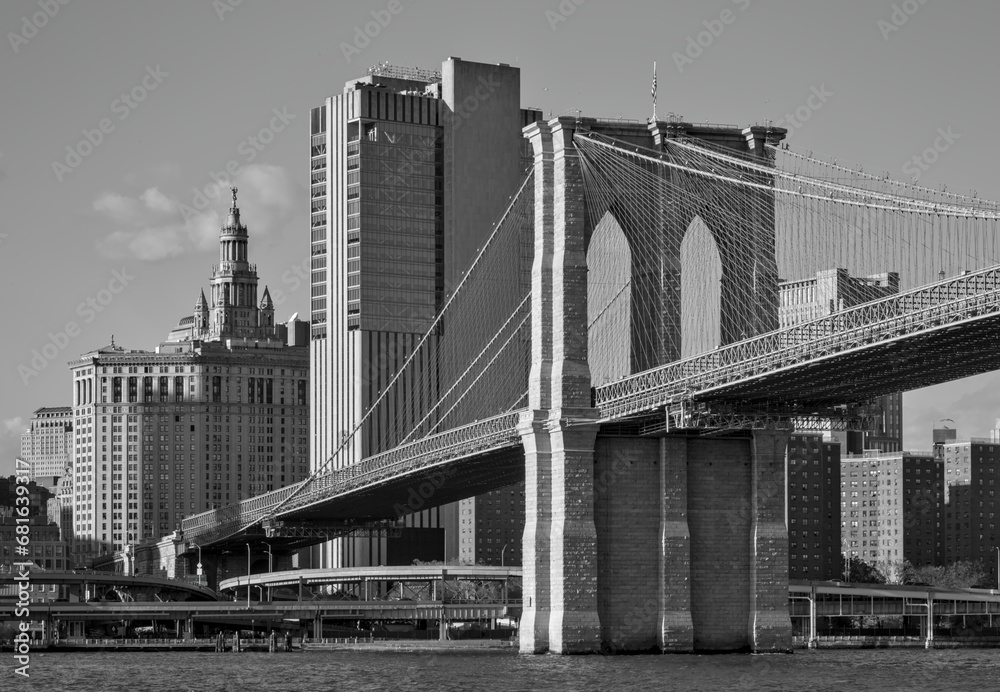 brooklyn bridge view over hudson river with nyc skyline background (urban cityscape of manhattan) black and white, dramatic, contrast monochrome detail - obrazy, fototapety, plakaty 