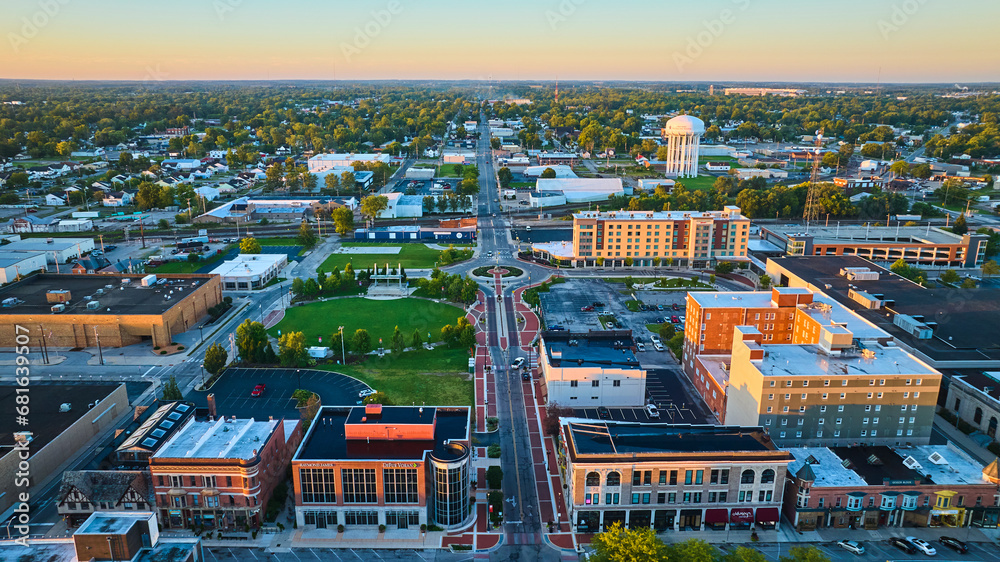 Canan Commons Park aerial at dawn with Muncie city buildings in aerial with water tower, IN