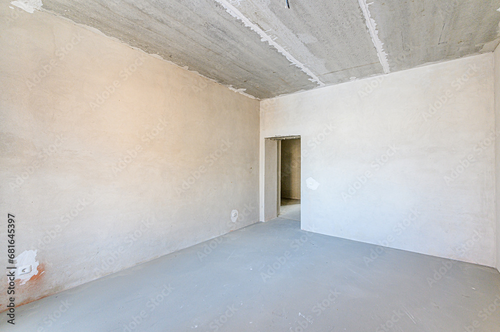 interior apartment rough repair for self-finishing. interior decoration, bare walls of the room, stage of construction interior apartment rough repair for self-finishing. interior decoration, bare walls of the room, stage of construction