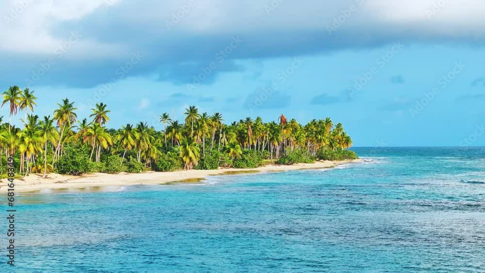 Rest on a deserted sea beach with palm trees. Travel to a paradise sea island. Turquoise ocean off the Dominican coast. Travel to palm island, idyllic video with tropical sea beach, copy space. Rest on a deserted sea beach with palm trees. Travel to a paradise sea island. Turquoise ocean off the Dominican coast. Travel to palm island, idyllic video with tropical sea beach, copy space.