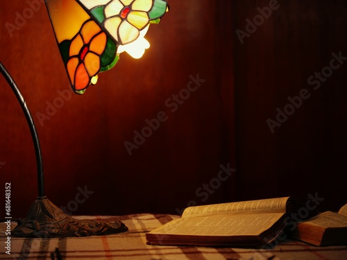 Books by a warm lamplight in study