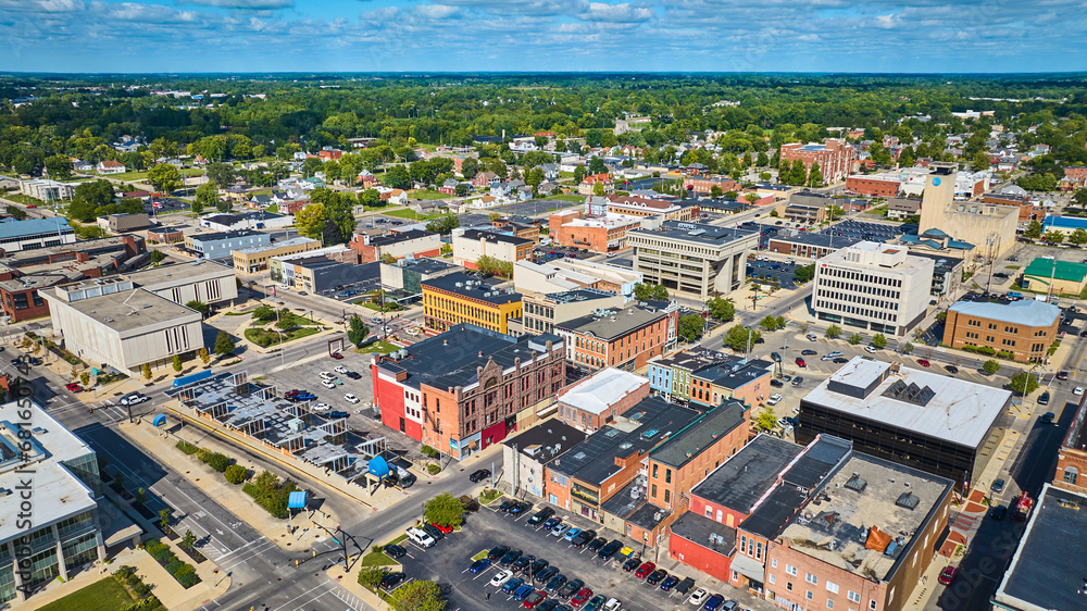 Downtown Muncie, IN aerial on bright sunny day with city buildings