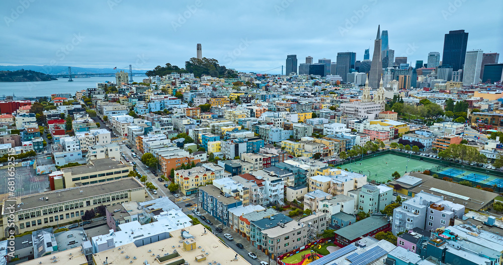 Sports tennis courts in San Francisco city, CA aerial with Coit Tower and skyscrapers