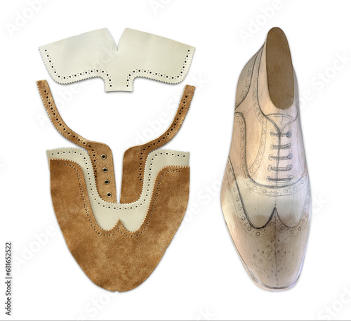 wooden form and leather for Oxford shoe, on white background, handcrafted, a manual processinog phase