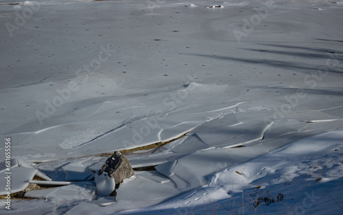 Ecological background. Cracked ice surface. Permafrost