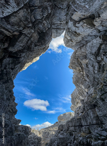 Magnificent views overlooking the sky from inside the mystical and deep cave