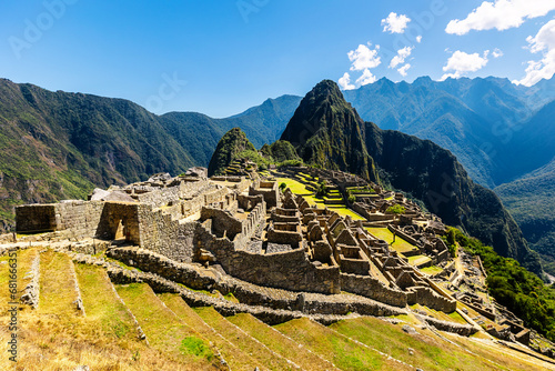 Panoramic view of Machu Picchu on a beautiful sunny day, The Valley of the Incas, Cuzco, Peru. Famous and tourist place in South America