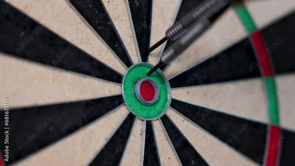 Darts in bull's eye close up. Darts arrows in the target center business goal concept. Slow Motion 4K. Darts in bull's eye close up. Darts arrows in the target center business goal concept. Slow Motion 4K.