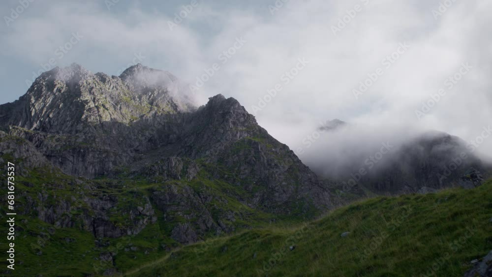 Time-lapse Of Cloud Movement Over Rugged Mountains Time-lapse Of Cloud Movement Over Rugged Mountains