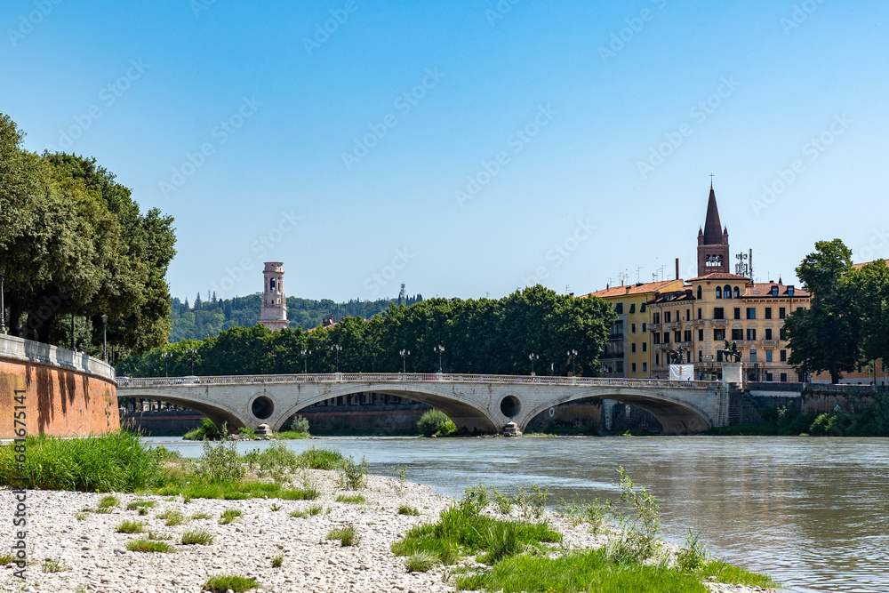 View of the Bridge Ponte Pietra in Verona on Adige river. Veneto region in Italy