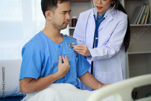 The doctor is carefully examining the patient's body to ensure the correctness of the treatment, Doctors use stethoscopes to listen to the patient's body to diagnose disease. © PaeGAG