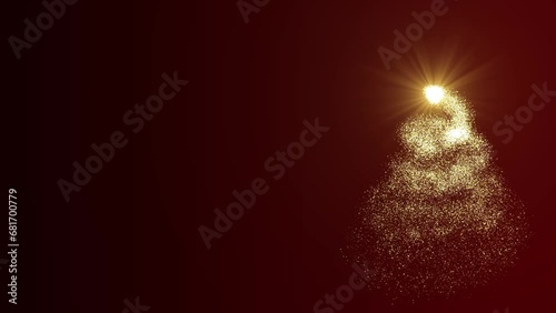 A bright light source draws a Christmas tree made of gold particles on a red background. Animation for Christmas holiday with free space. photo