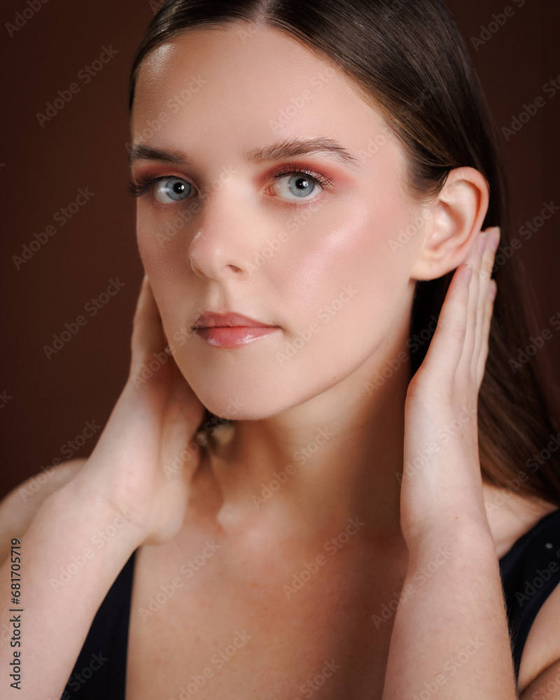 Beauty model on brown background with full makeup pink eyes