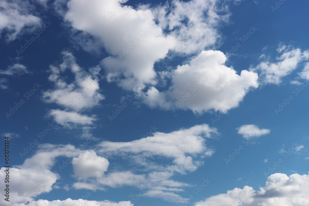 Light gray clouds against a blue sky. Light gray clouds against a blue sky.