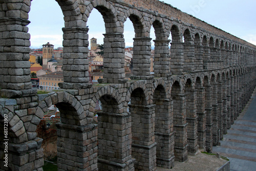Close-up view of part of the stone arched double-tiered aqueduct in the historic part of the city of Segovia, near Madrid, Spain