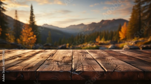 An empty wooden brown table with a blurred backgroun © ProVector