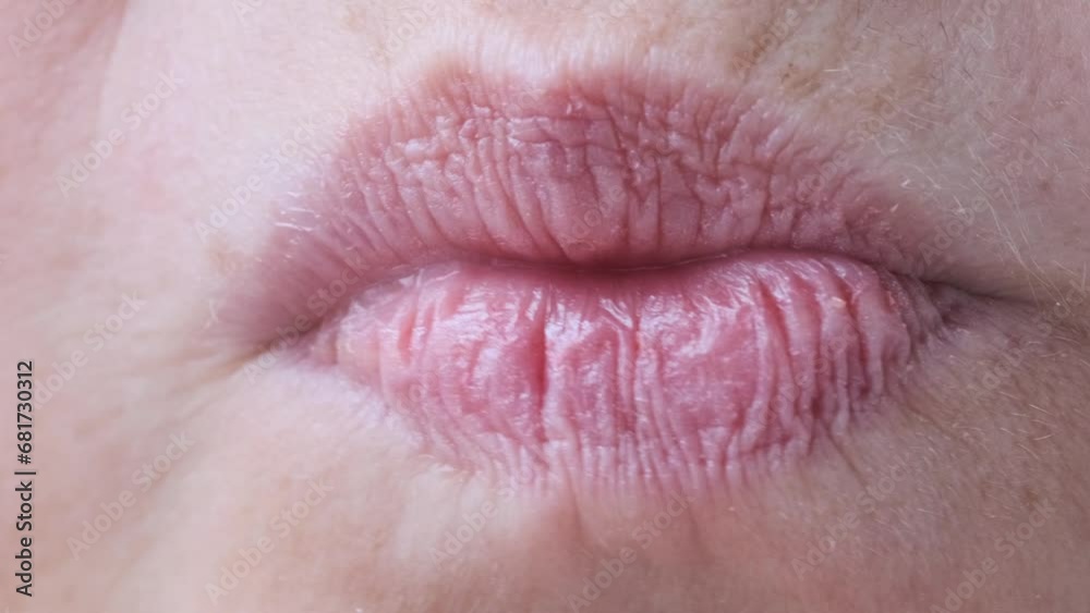 close up lips of mature female face, woman 50 years old carefully examines wrinkles around mouth, skin defects, facial hair, age-related changes, aesthetic cosmetology, anti-aging procedures close up lips of mature female face, woman 50 years old carefully examines wrinkles around mouth, skin defects, facial hair, age-related changes, aesthetic cosmetology, anti-aging procedures