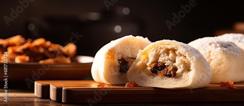 In the closeup, a delicious and fresh dim sum snack is showcased, a traditional Chinese pastry made of healthy, white bread cooked in a wooden bakery - truly a tasty and satisfying meal.