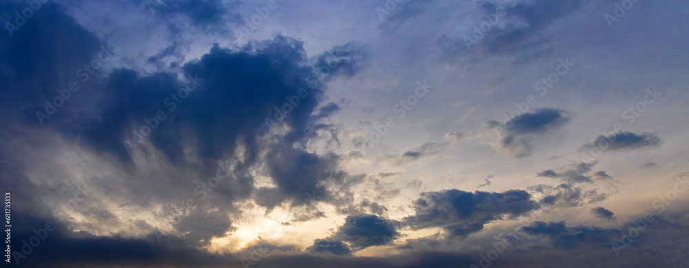 Dark ominous sky with blue clouds during sunrise