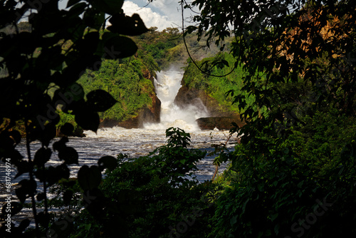 Murchison Falls National Park in Uganda, beautiful water falls on the river Victoria Nile, rainbow above the Uhuru falls and Kabarega falls waterfall in Africa photo