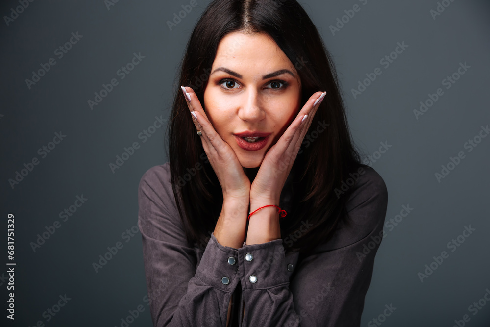 A woman with her hands on her face. A Woman in Deep Thought with Hands on Her Face A woman with her hands on her face. A Woman in Deep Thought with Hands on Her Face