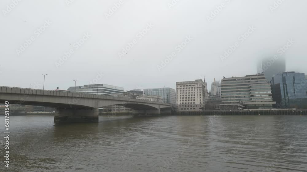 Top of then buildings hidden in fog near the London Bridge. Top of then buildings hidden in fog near the London Bridge.