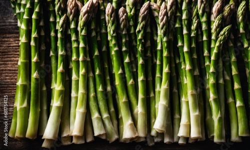Asparagus. Fresh green asparagus on wooden background. Vegan healthy food