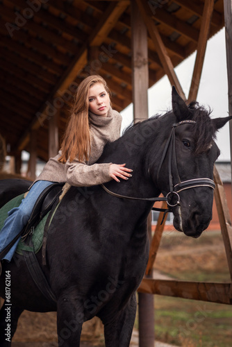 pretty young girl with long hair with a horse on an autumn day  © ketrin