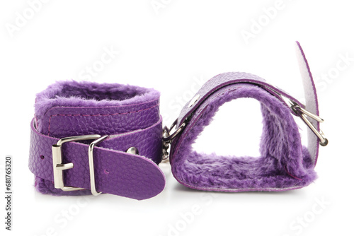 Purple handcuffs from sex shop on white background