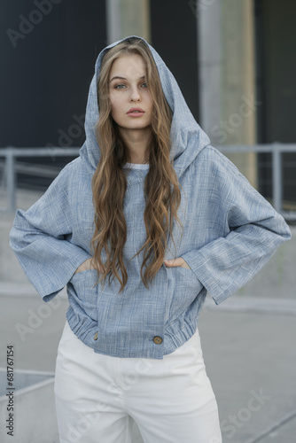 long hair girl in a hoodie outdoors