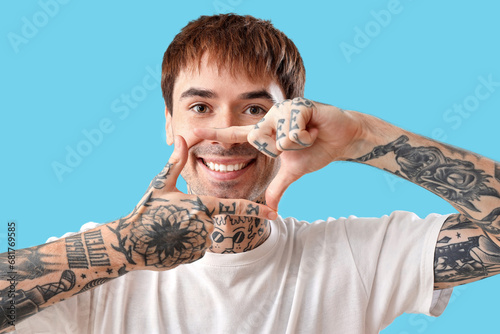 Young tattooed man with too...