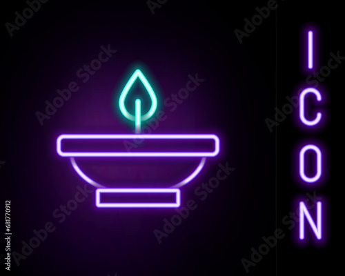 Glowing neon line Aroma lamp icon isolated on black background. Colorful outline concept. Vector