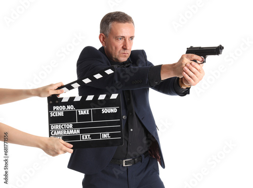 Mature actor holding gun an...