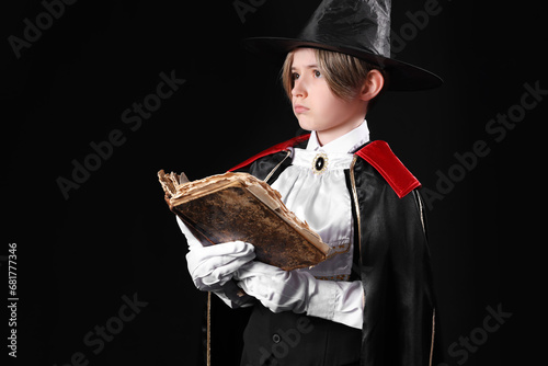 Little actor dressed as mag...