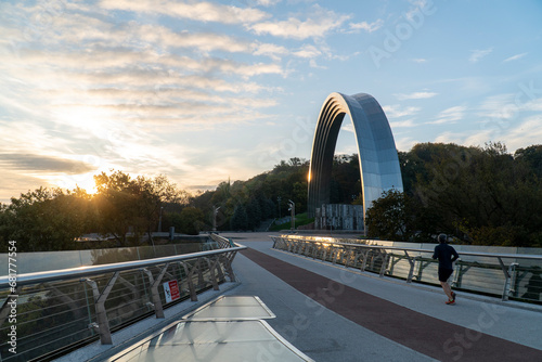 Glass bridge and arch of peoples' friendship in Kyiv photo