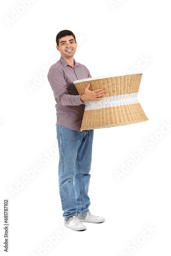 Young man carrying rattan t...
