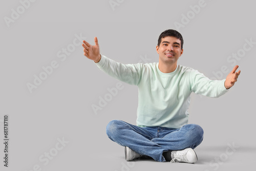 Young man opening arms for ...