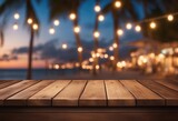 Wooden table and blur beach cafes background with bokeh lights High quality photo