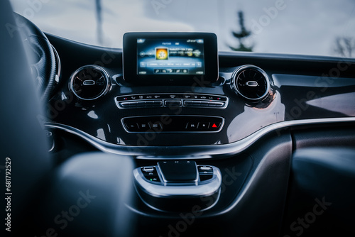 Modern car interior with big multimedia screen, sport steering wheel © P.W-PHOTO-FILMS