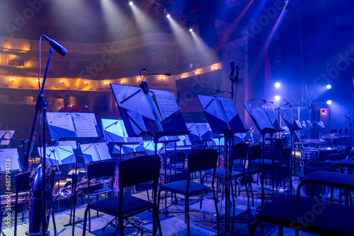 music stands with orchestral notes in the concert hall photo