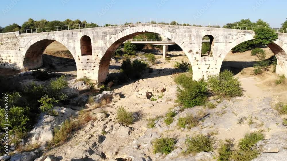 Aerial drone view of Julian bridge, Roman stone arch bridge in Provence, Southern France Aerial drone view of Julian bridge, Roman stone arch bridge in Provence, Southern France