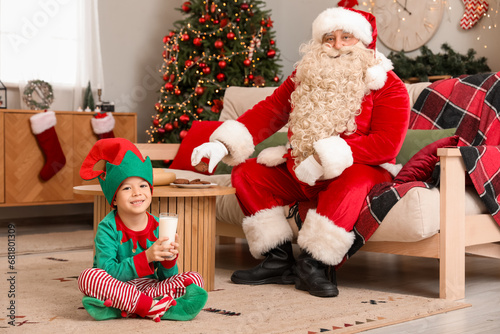 Santa Claus and cute little...