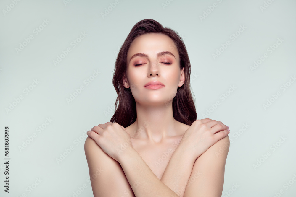 Photo portrait of pretty young girl embrace self enjoy touch shoulder spa salon isolated on light gray color background Photo portrait of pretty young girl embrace self enjoy touch shoulder spa salon isolated on light gray color background
