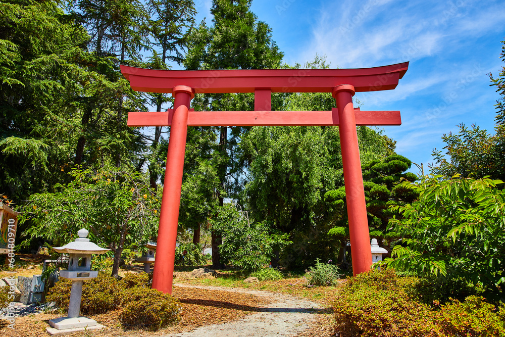 Red Torii Gate in Japanese Garden with stone lanterns lining path at The Gardens at Lake Merritt Red Torii Gate in Japanese Garden with stone lanterns lining path at The Gardens at Lake Merritt