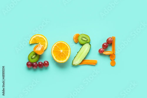 Figure 2024 made of fresh fruits and vegetables on color background