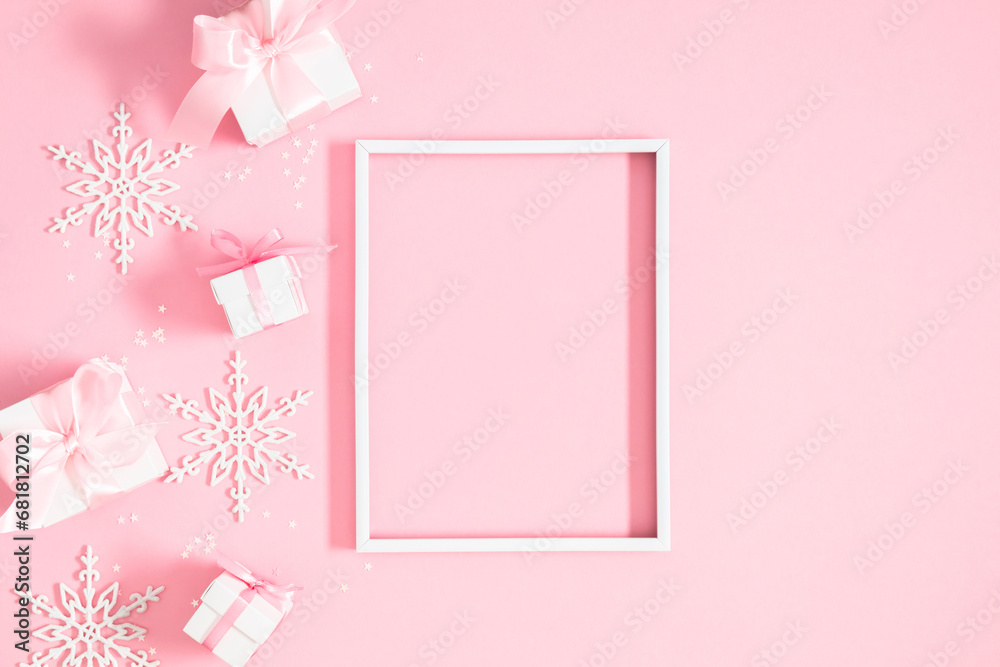 Christmas holiday composition. Photo frame, Xmas toys, decorations, gift on pastel blue background. Xmas, winter, new year concept. Flat lay, top view, copy space 