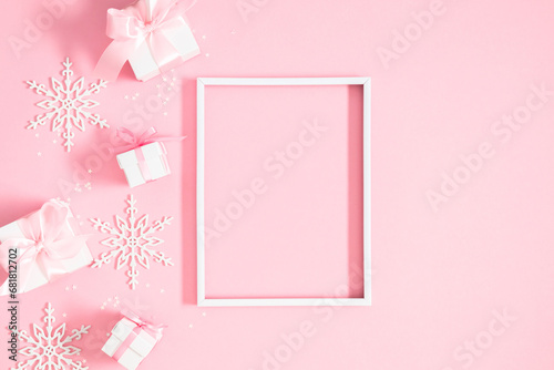 Christmas holiday composition. Photo frame, Xmas toys, decorations, gift on pastel blue background. Xmas, winter, new year concept. Flat lay, top view, copy space  © prime1001
