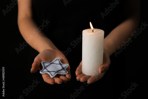 Woman with burning candle a...